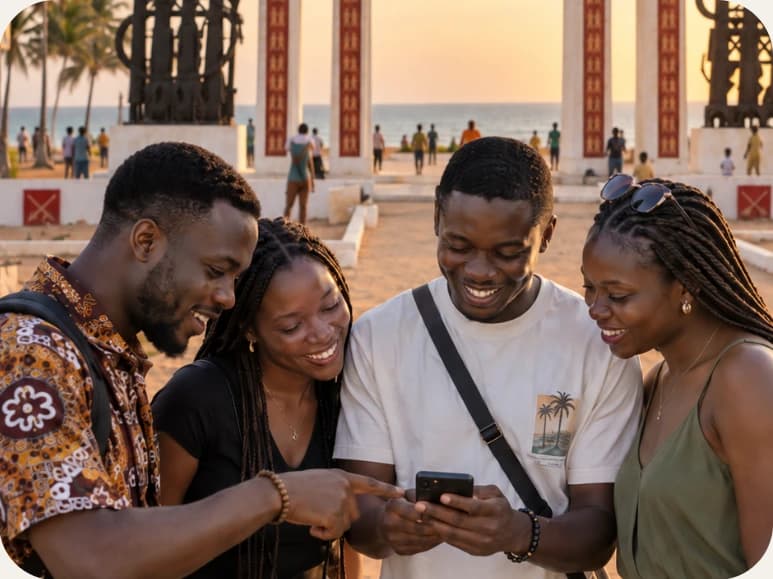 Amis réunis devant un monument à Ouidah